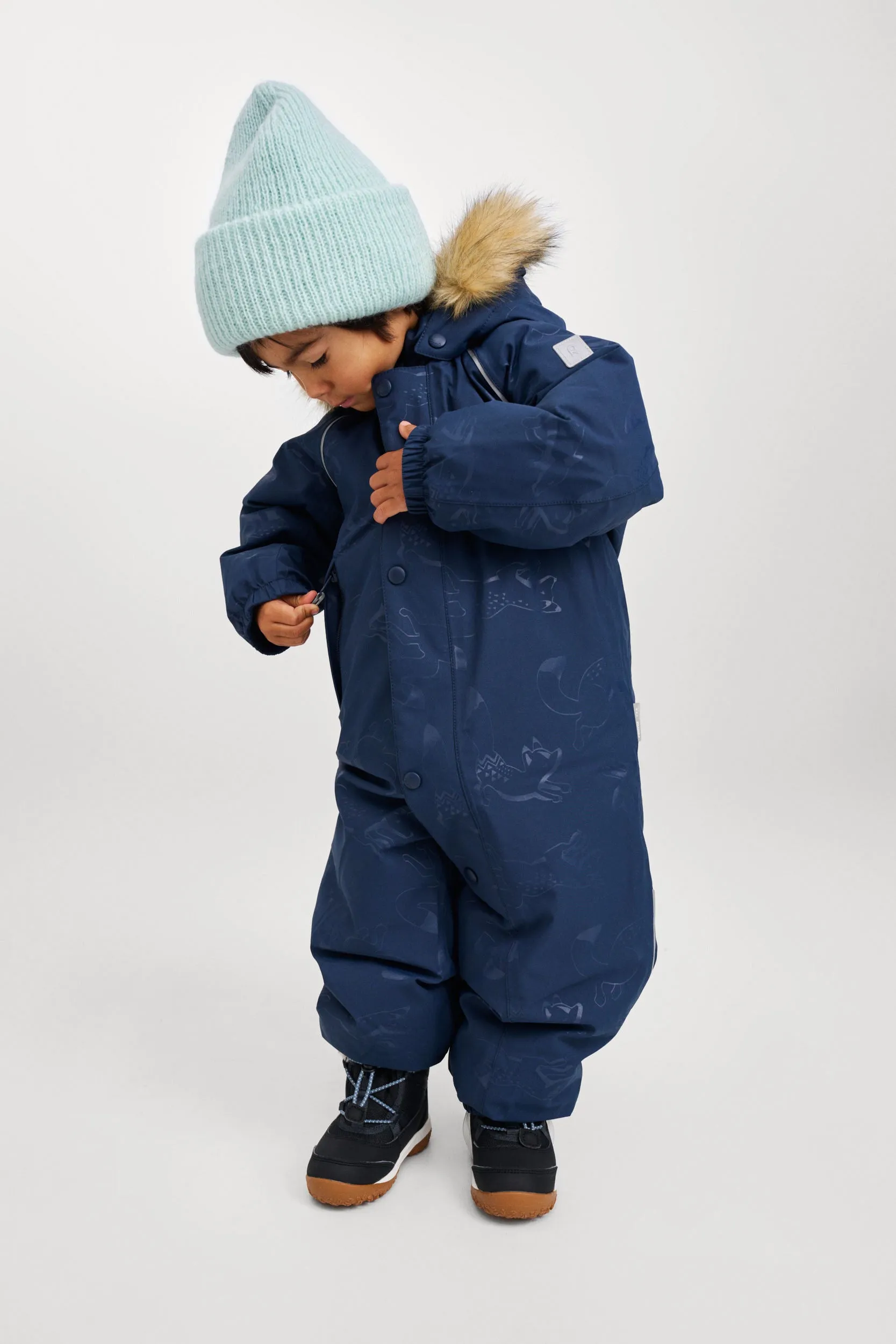 REIMA TEC Winteroverall/Skianzug <br> Aapua <br>Gr. 74 bis 92<br>echte Daunen-Füllung, extra warm<br> Po-Bereich extra dick isoliert<br> auch ohne Kunst-Pelz tragbar<br> abnehmbare Fuss-Schlaufen<br> WS >12'000 mm